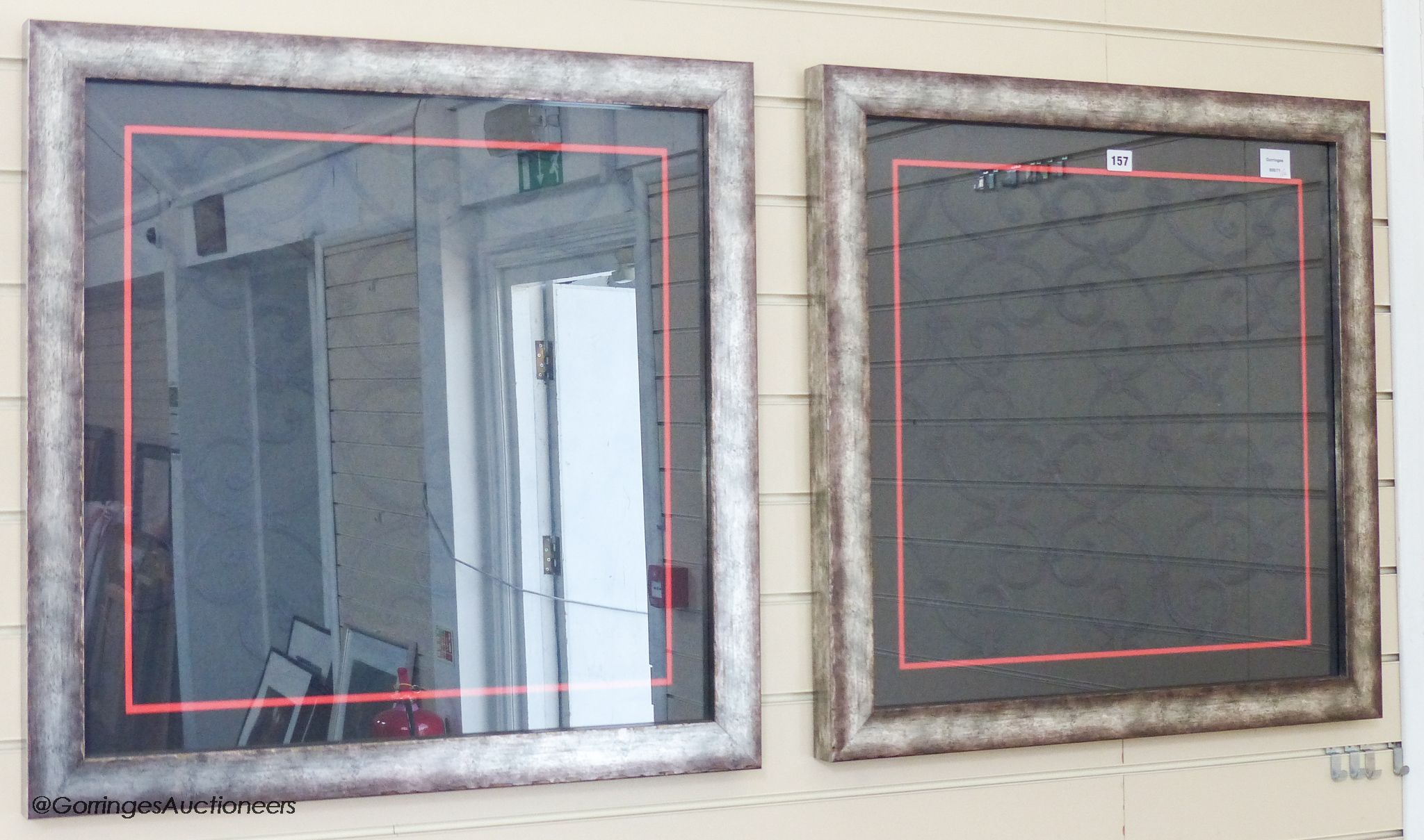 A pair of framed embroidered panels